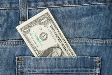Macro shot of trendy jeans with american 1 dollar bill