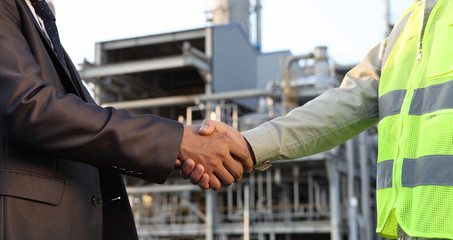 businessman and engineer oil refinery
