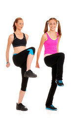 Two women doing zumba fitness