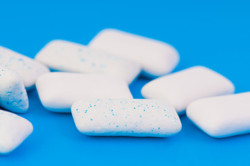 Chewing gums on blue