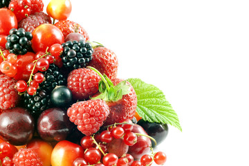 assortment of fresh berries and fruit on white background