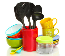 bright empty bowls, cups and kitchen utensils isolated on white