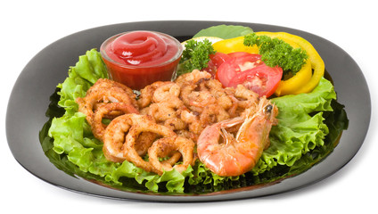 Tasty deep fried squid rings and fried prawn with vegetables