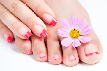 Foto auf Acrylglas manicure and pedicure relaxing with flowers © Dmytro Titov