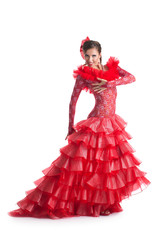 Young woman in red dress performing flamenco