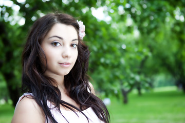 Beautiful woman in the summer park