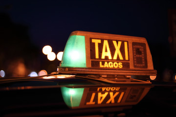Lagos taxi sign illuminated at night, Algarve Portugal
