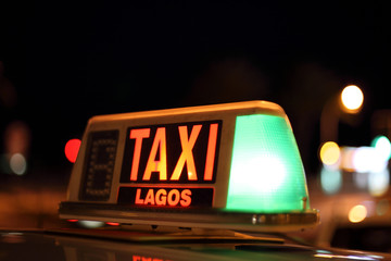 Lagos taxi sign illuminated at night, Algarve Portugal
