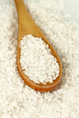 Sea salt with wooden spoon close-up