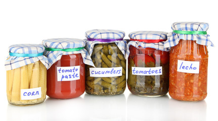 Jars with canned vegetables isolated on white