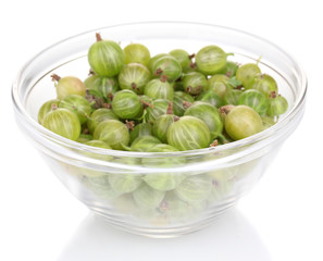 Green gooseberry in glass bowl isolated on white