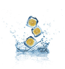 Lemons in ice cubes splashing into water