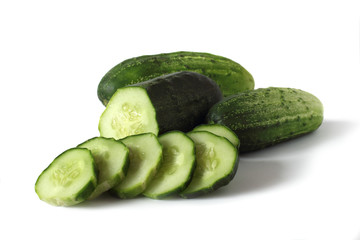 cucumbers and slices isolated on white background