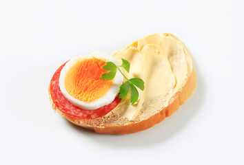 Bread with salami and egg