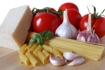 ingredients for italian spaghetti: tomatoes, garlic, pasta, basi