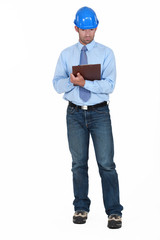 Building planner holding clip-board