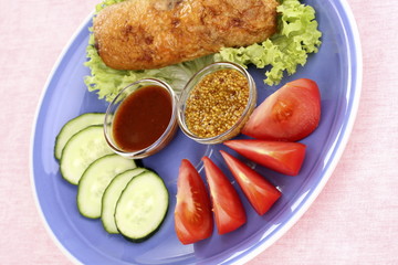 Tasty meat cutlet with garnish on plate
