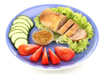 Tasty meat cutlet with garnish on plate isolated on white