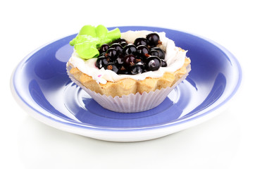 sweet cake with berries on saucer isolated on white