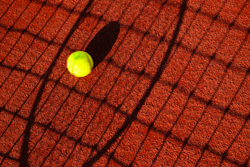 tennis ball in shadow net