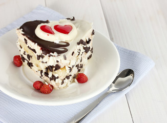 sweet cake with chocolate on plate on wooden table