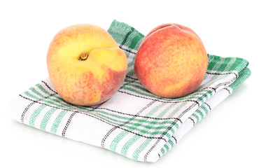 ripe peaches on napkin isolated on white.