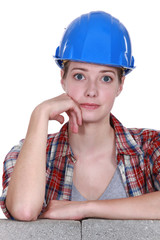 Wide eyed female construction worker