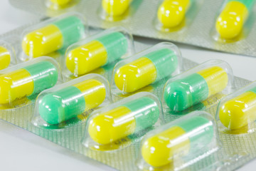 green-yellow capsules in the strips