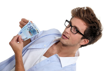 man holding a dozen of banknotes