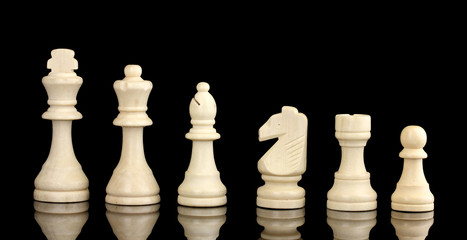 Chess pieces isolated on black