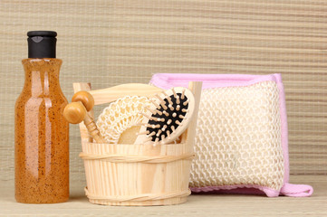 Bathroom set with scrub on bamboo background