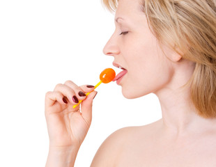 Woman licking lollipop on white background. Symbol of temptation