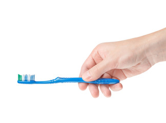 toothbrush in a male hand on a white background