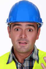 Builder with confused look on his face