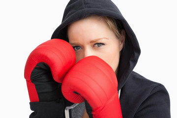 Woman with hoodie boxing