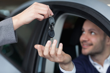 Man receiving car keys