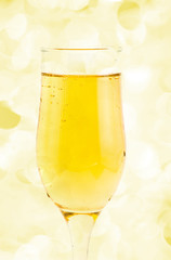 glass of champagne on holiday lights
