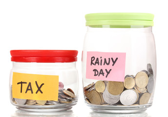 Glass banks for tips with money isolated on white