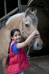 Little girl with her favorite horse