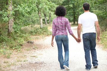 Couple walking in a forest