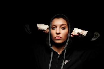 Portrait of a beautiful boxer girl with white bandage on hands