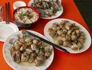 Fresh clams with chili in local seafood restaurant, China