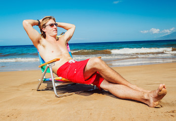 Young Man Relaxing at the Beach