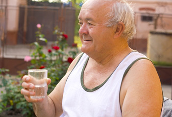 old man drinking water