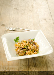 Fregola con arselle, recipe of typical pasta of Sardinia