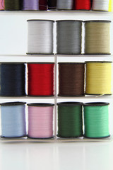 Stacked spools of thread.