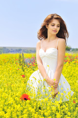 girl wearing white dress in the field