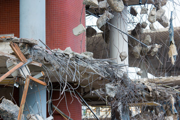 Demolition of a building with concrete floors and pillars