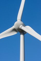 Big white windmill with blue and clear sky