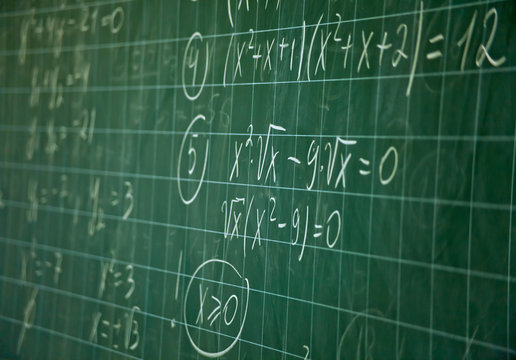 Green blackboard with solution of the mathematical equation